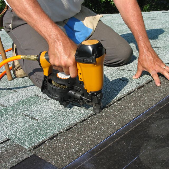 Roof shingles being laid